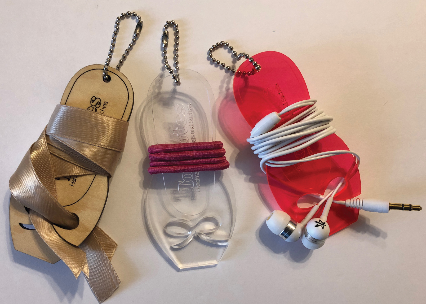 Three keychains demonstrating each of the designed functions